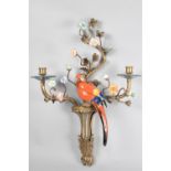 A Bronze and Porcelain Two Branch Wall Hanging Candelabra in the form of Parrot Perched Amongst