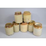 A Collection of Seven Glazed Stoneware Jars