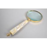 A Modern Large Desktop Magnifying Glass with Mother of Pearl and Brass Handle, 25cm long