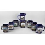 A Collection of Eight Limited Edition Cobalt Blue and Gilt Jugs for the Grand National