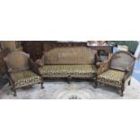 An Edwardian Mahogany Framed Bergere Three Piece Suite with Carved Scrolled Arms and Claw and Ball