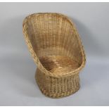 A Woven Wicker Tub Chair