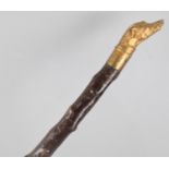 A Novelty Thornwood Walking Cane with Carved and Gilt Painted Greyhound Head Handle, 81cm long