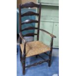 A Late 19th Century Rush Seated Ladder Back Armchair