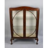 An Edwardian Mahogany Arched Topped Display Cabinet on Short Cabriole Supports with Claw and Ball