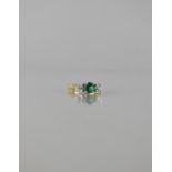 A Gold Coloured Metal and Three Stone Ring, Central Round Brilliant Cut Green CZ Stone Approx 6mm