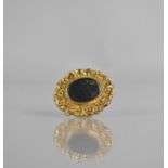 A 19th Century Gold Mounted Mourning Brooch, Central Oval Glass Panel Having Finely Woven Organic