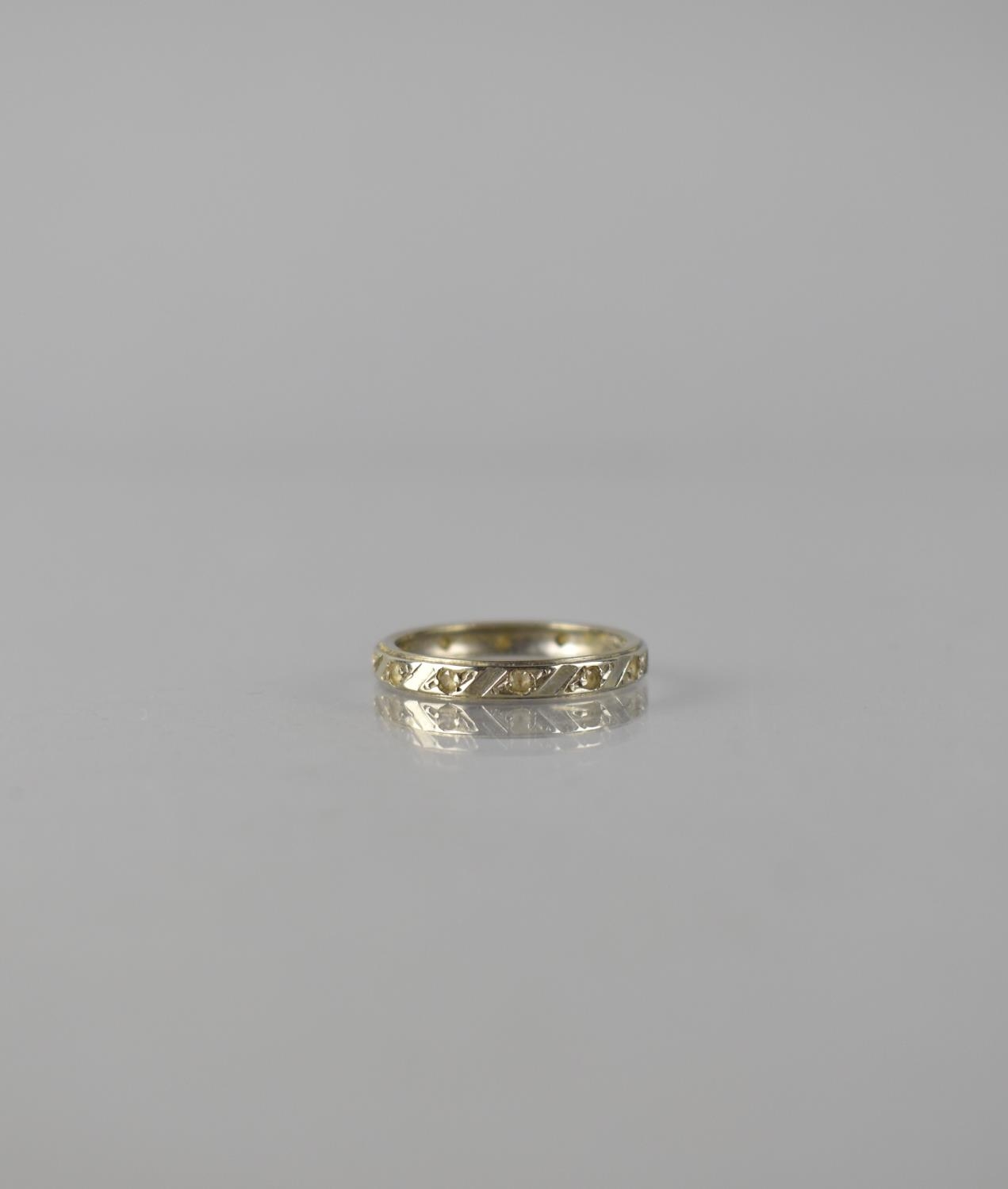 An Early 20th Century 18ct Gold and White Stone Eternity Ring, 13 Round Cut White Stones Grain Set