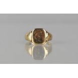 A 9ct Gold Gents Signet Ring, Octagonal Head with Traces of Engraved Decoration, Stepped Shoulders