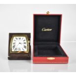 A Cartier La Dona Travel Desk Clock. Shaped White Dial with Roman Numerals, Blue Diamond Shaped
