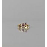 An 18ct Gold, Diamond and Ruby Floral Cluster Ring, Centre Round Cut Ruby Measuring Approx 3mm