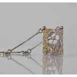 A Mid Century Silver Rectangular Pendant and Chain, Hand Hammered and Fret Cut with Five Petal