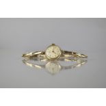 A 9ct Gold Early 20th Century Ladies Wrist Watch by Vertex, Champagne Dial with Gold Coloured Hands,