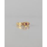 An 18ct Gold, Ruby and Diamond Seven Stone Boat Ring, Central Mixed Cut Ruby Measuring 3.5mm by