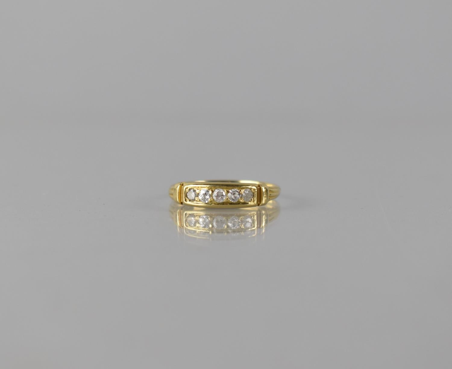 An 18ct Gold and Diamond Dress Ring, Five Mixed Cut Diamonds in Bead Bright Cut Setting, Head