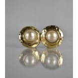A Pair of Vintage Gold Tone and Faux Pearl Yves Saint Laurent Clip On Earrings, Central Pearl