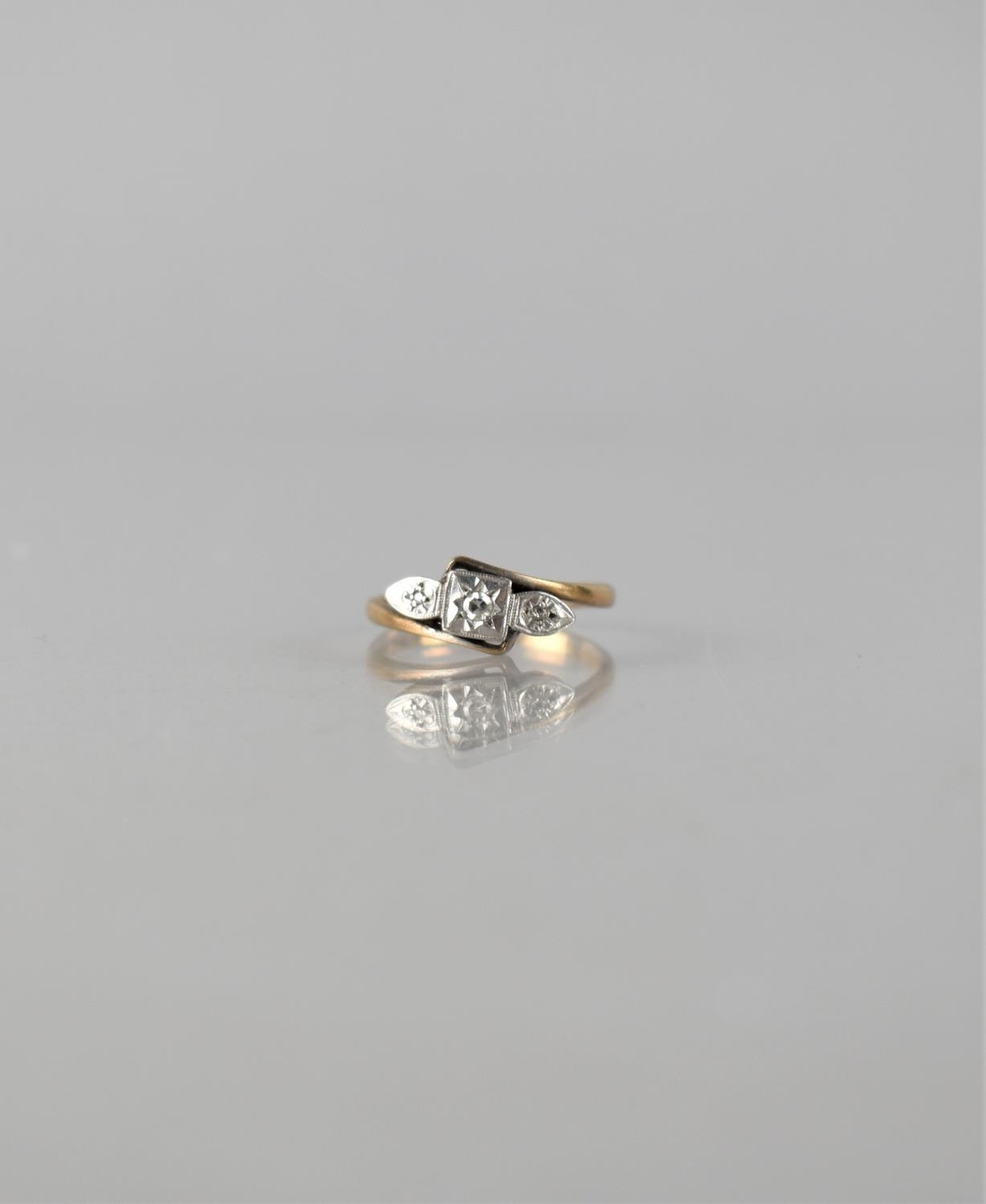 An Early 20th Century 9ct Gold and Platinum Mounted Three Stone Diamond Ring, Central Round Cut