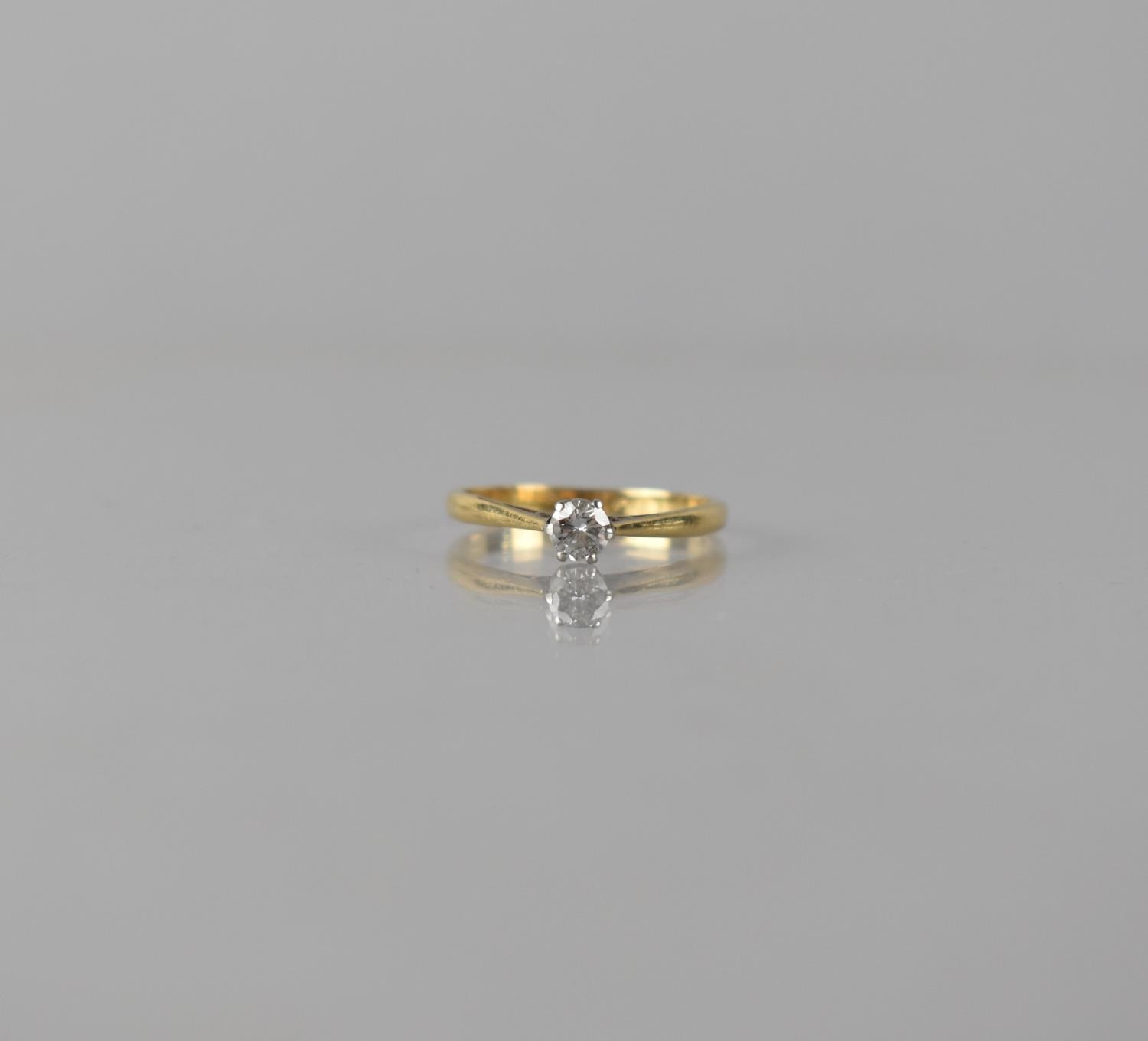 An 18ct Gold and Platinum Diamond Solitaire Ring, Centre Round Brilliant Cut Stone Measuring