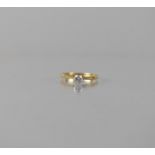 An 18ct Gold and Platinum Diamond Solitaire Ring, Centre Round Brilliant Cut Stone Measuring