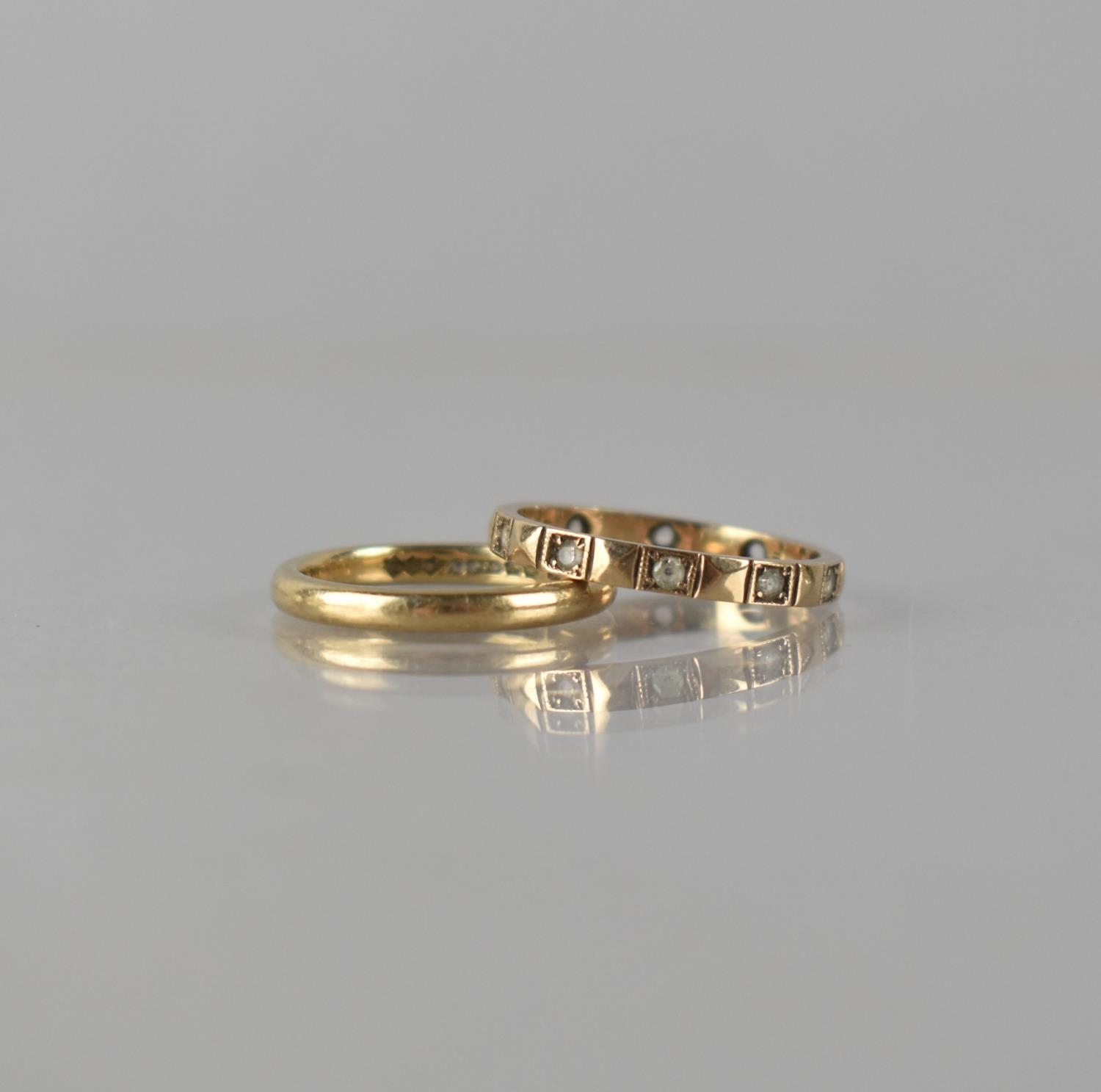 A 9ct Gold Wedding Band, Court Shape, Birmingham Hallmark and Makers Mark S&Co Size J.5, together