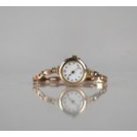 A 9ct Rose Gold Early 20th Century Wrist Watch, White Enamel Dial, Arabic Numerals, Gold Dot