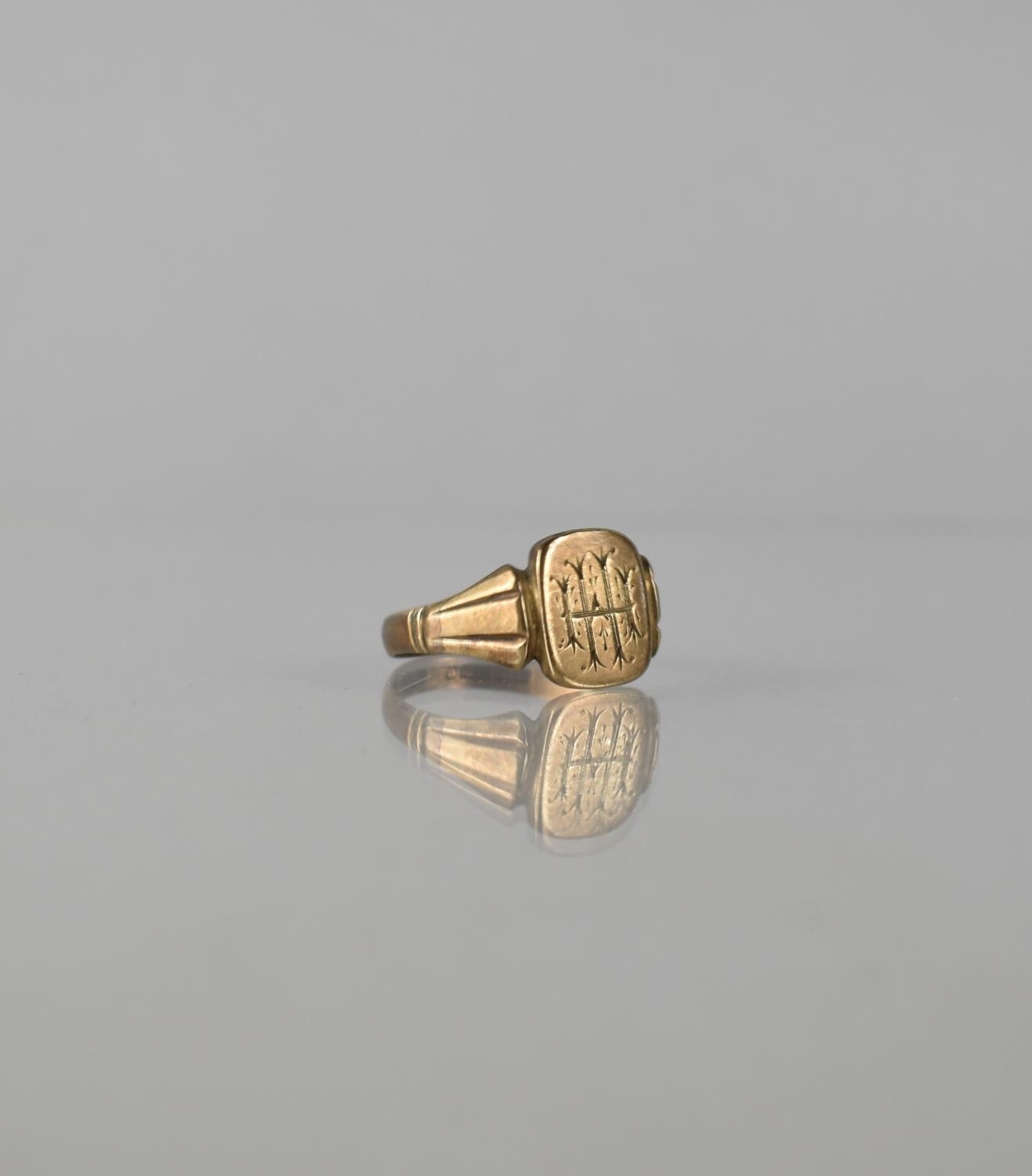 A 9ct Gold Signet Ring, Rectangular Head Monogrammed H M, Tapered Fluted Shoulders to a Flattened