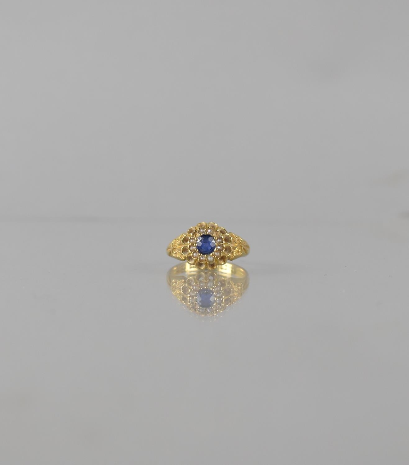 A Victorian Sapphire and Seed Pearl Ladies Dress Ring, Central Stone Measuring 4mm by 3.5mm Approx