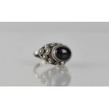 A Mexican Silver and Onyx 'Poison Ring', Oval Cabochon Onyx Stone (10mm by 8mm) to Hinged Head