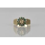 A 9ct Gold, Emerald and Diamond Cluster Ladies Dress Ring, Central Raised Small Round Cut Diamond,
