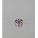 A Late 20th Century 9ct Gold and Sapphire Seven Stone Dress Ring. Central Oval Cut Sapphire