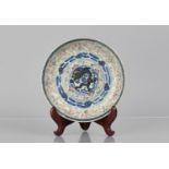 A Chinese Porcelain Dish decorated with Underglaze Blue Design with Central Dragon and Flaming Pearl