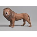 A Reproduction Cold Painted Bronze Study of a Lion, 10cms Long