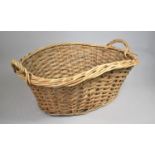 A Large Wicker Basket with Twin Carrying Handles, 73cms Wide