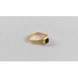 A 18ct Gold and Black Stone Ring, 3.3g