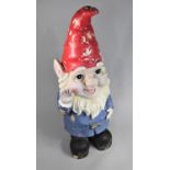 A Large Resin Study of a Gnome Waving with a Red Hat ad Blue Coat, 90cms High, Condition Issues to