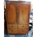 A 19th Century Mahogany Twin Door Linen Press on Two Short and One Long Drawer Base, with