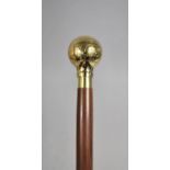 A Modern Turned Wooden Walking Cane with Polished Brass Handle Decorated with Naive Map of The World