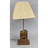 A Novelty Table Lamp in the Form of Leather Bound Books, 64cms High