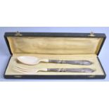 A Cased Pair of Continental (Probably French) Silver Handled and Bakelite Salad Servers