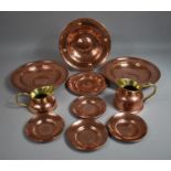 A Collection of Copper Chargers together with Two Brass and Copper Jugs