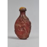 A Chinese Moulded Amber Glass Snuff Bottle, 7cm high