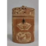 A Chinese Cylindrical Bamboo Tea Caddy having Intricately Carved Decoration Depicting Elder