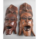 A Pair of Carved Wooden African Souvenir Masks, Tallest 39cm high