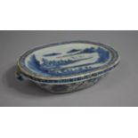 A Chinese Porcelain Warmer Dish of Oval Form Decorated in Underglaze Blue and White with River