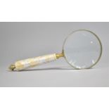 A Novelty Large Desk Top Magnifying Glass with Mother of Pearl Handle, 25cms Long