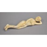 A Carved Bone Effect Study of a Reclining Nude, 13cm Long