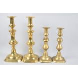 Two Pairs of Late Victorian Brass Candlesticks, Both with Pushers, 30cms and 23.5cms High