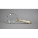 A Modern Large Desktop Magnifying Glass with Brass Frame and Mother of Pearl Handle, 25cms Long