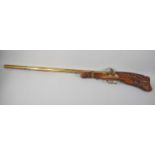 A Reproduction Brass and Carved Wood Wall Hanging Model of a Flintlock Rifle