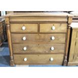 A Victorian Scottish Chest of Two Short and Three Long Drawers with Turned Pilasters and Ceramic